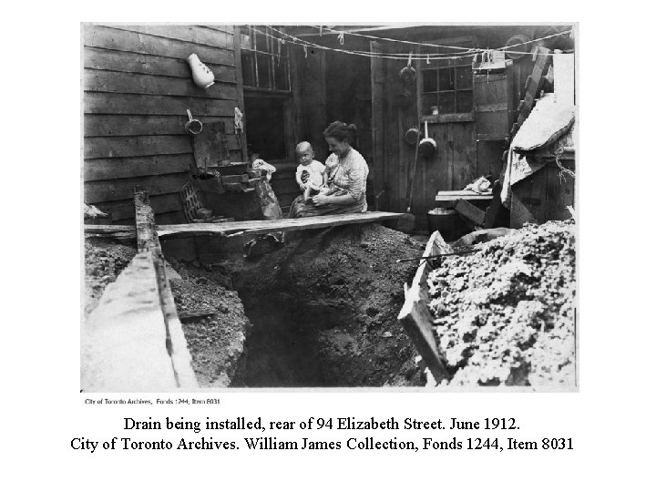 Drain being installed, rear of 94 Elizabeth Street. June 1912. City of Toronto Archives.
