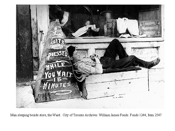 Man sleeping beside store, the Ward. City of Toronto Archives. William James Fonds 1244,