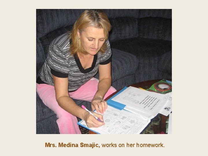 Mrs. Medina Smajic, works on her homework. 