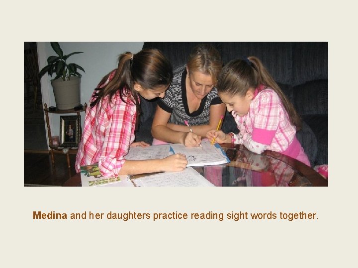 Medina and her daughters practice reading sight words together. 