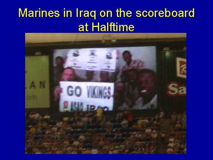 Marines in Iraq on the scoreboard at Halftime 