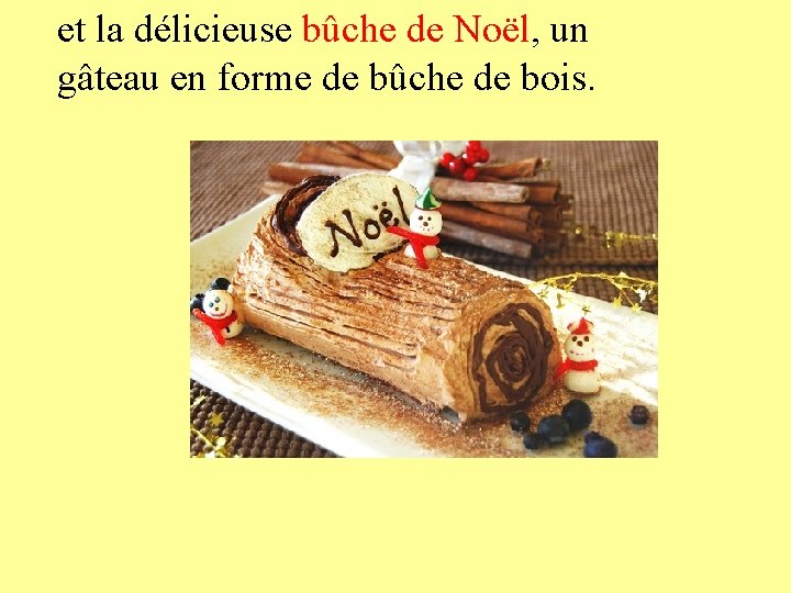 et la délicieuse bûche de Noël, un gâteau en forme de bûche de bois.