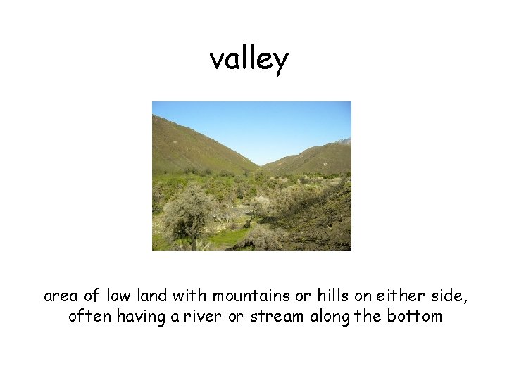 valley area of low land with mountains or hills on either side, often having