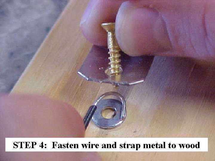 STEP 4: Fasten wire and strap metal to wood 