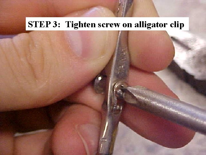 STEP 3: Tighten screw on alligator clip 