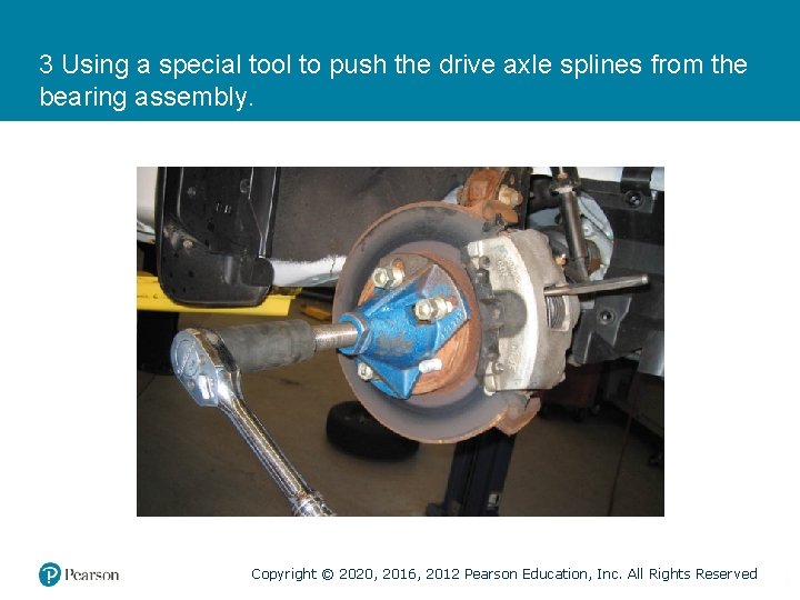 3 Using a special tool to push the drive axle splines from the bearing