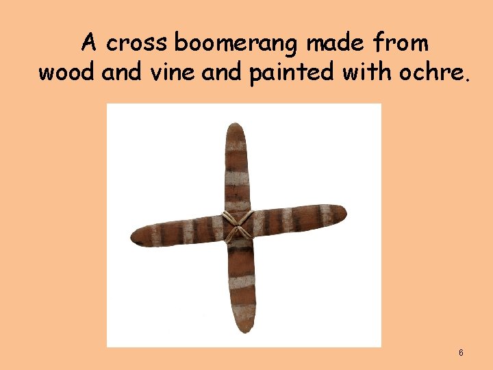 A cross boomerang made from wood and vine and painted with ochre. 6 