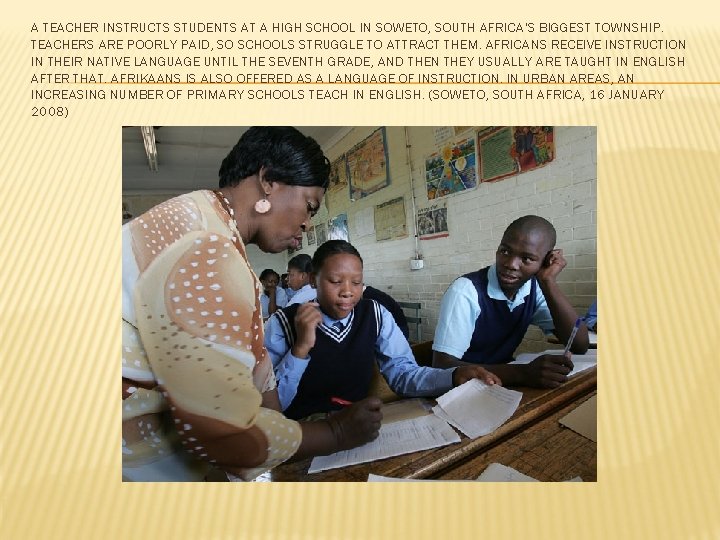 A TEACHER INSTRUCTS STUDENTS AT A HIGH SCHOOL IN SOWETO, SOUTH AFRICA'S BIGGEST TOWNSHIP.