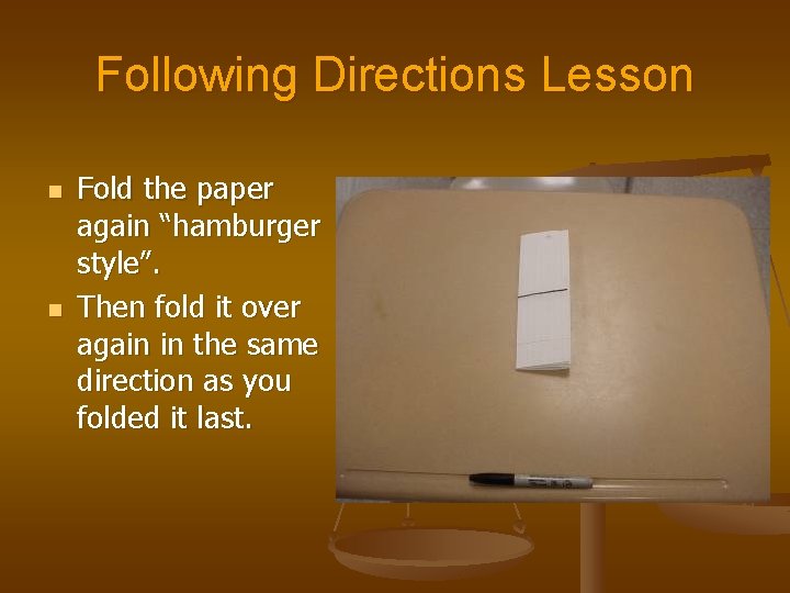 Following Directions Lesson n n Fold the paper again “hamburger style”. Then fold it Following Directions Lesson n n Fold the paper again “hamburger style”. Then fold it