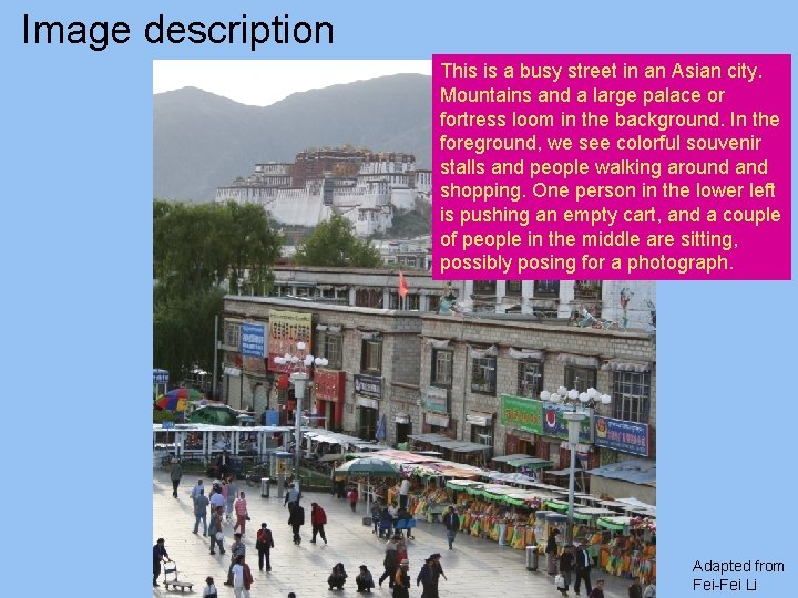 Image description This is a busy street in an Asian city. Mountains and a