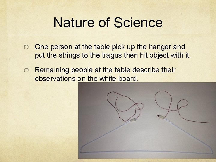 Nature of Science One person at the table pick up the hanger and put