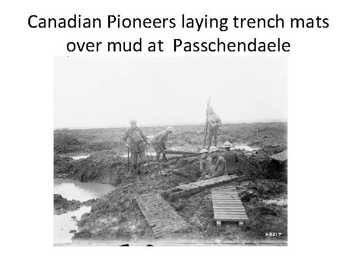 Canadian Pioneers laying trench mats over mud at Passchendaele 