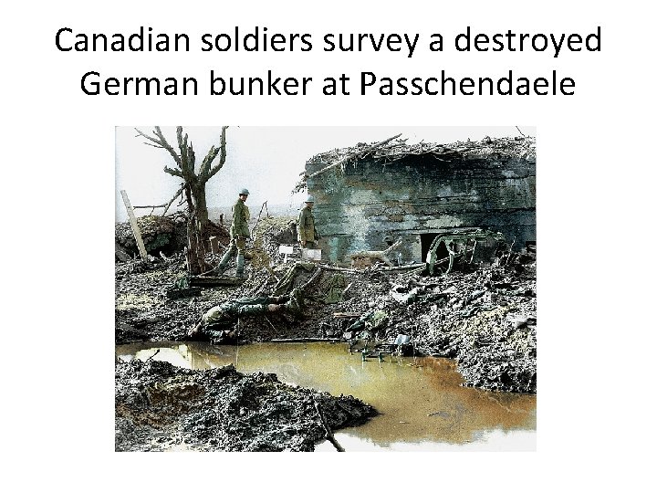 Canadian soldiers survey a destroyed German bunker at Passchendaele 