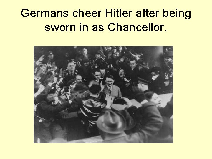 Germans cheer Hitler after being sworn in as Chancellor. 