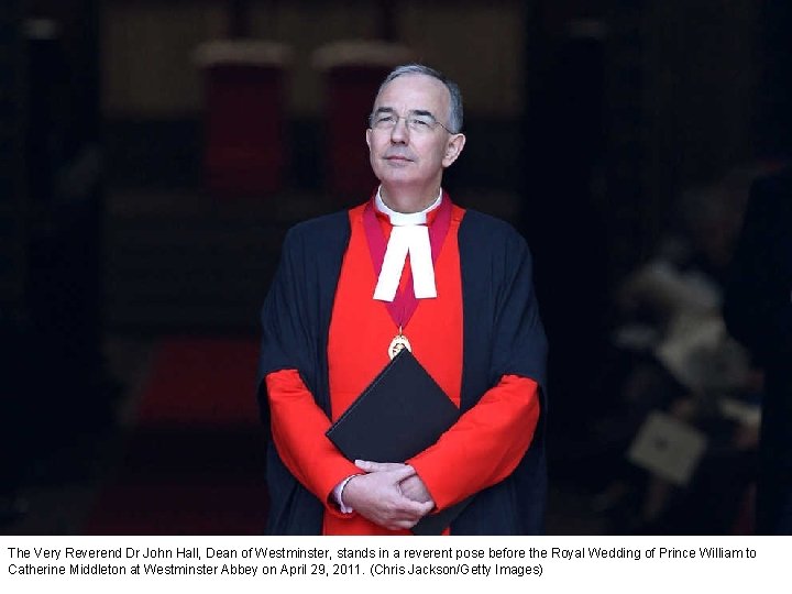 The Very Reverend Dr John Hall, Dean of Westminster, stands in a reverent pose
