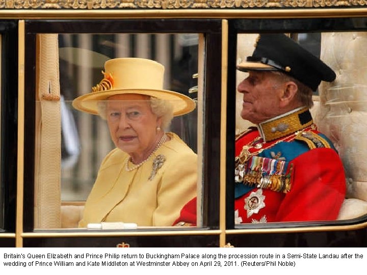 Britain's Queen Elizabeth and Prince Philip return to Buckingham Palace along the procession route