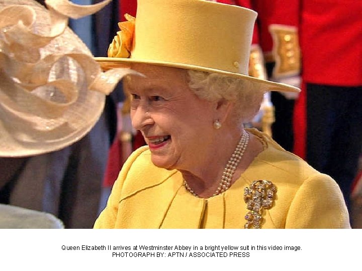 Queen Elizabeth II arrives at Westminster Abbey in a bright yellow suit in this