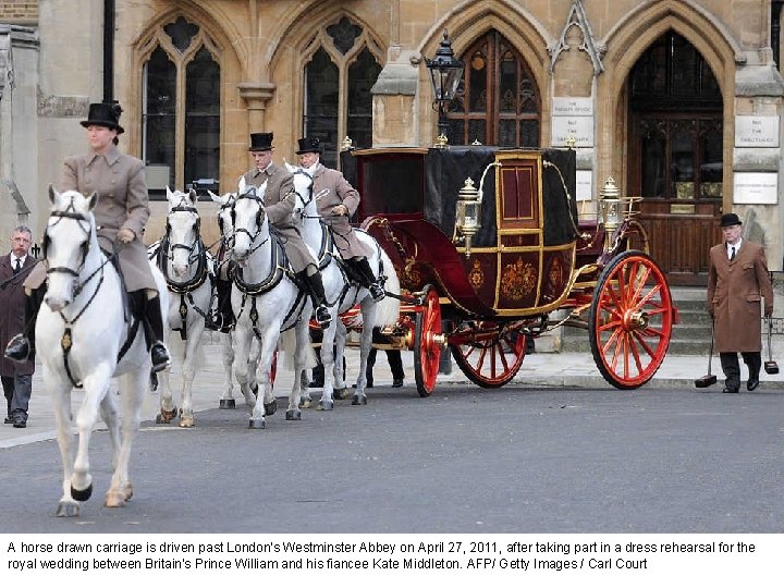 A horse drawn carriage is driven past London's Westminster Abbey on April 27, 2011,