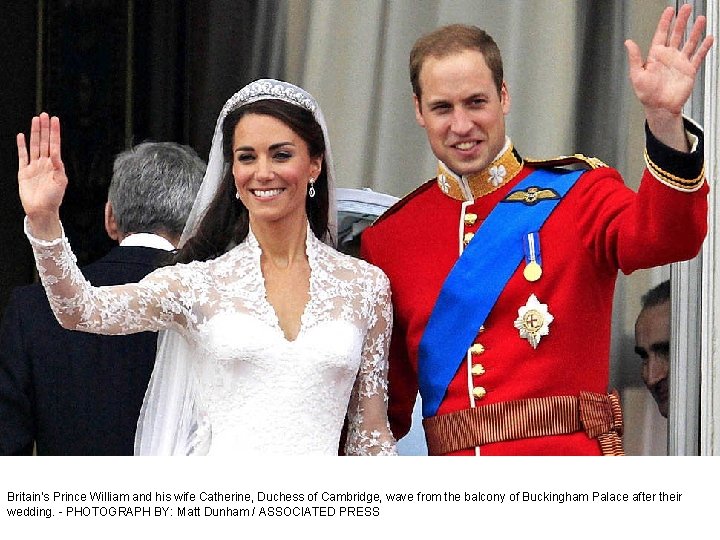 Britain's Prince William and his wife Catherine, Duchess of Cambridge, wave from the balcony