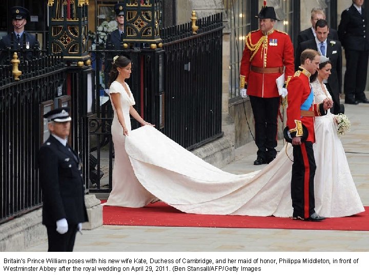 Britain's Prince William poses with his new wife Kate, Duchess of Cambridge, and her