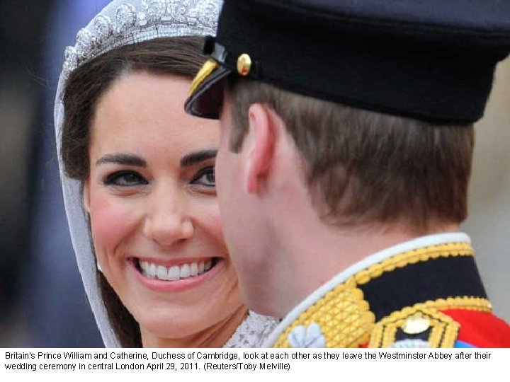 Britain's Prince William and Catherine, Duchess of Cambridge, look at each other as they