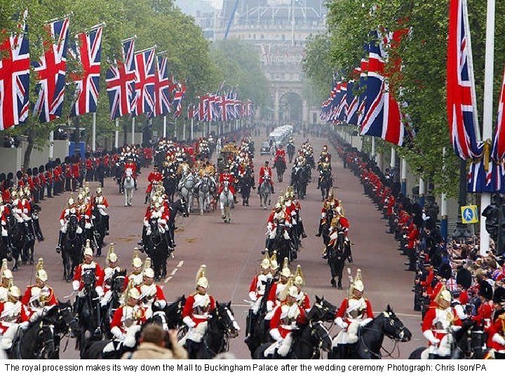 The royal procession makes its way down the Mall to Buckingham Palace after the
