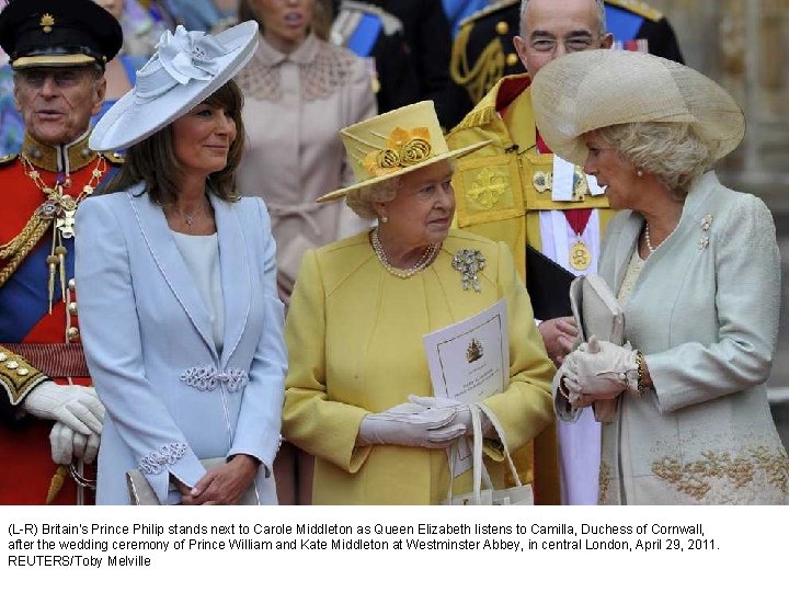 (L-R) Britain's Prince Philip stands next to Carole Middleton as Queen Elizabeth listens to