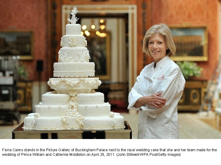 Fiona Cairns stands in the Picture Gallery of Buckingham Palace next to the royal