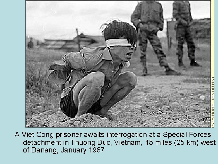 A Viet Cong prisoner awaits interrogation at a Special Forces detachment in Thuong Duc,
