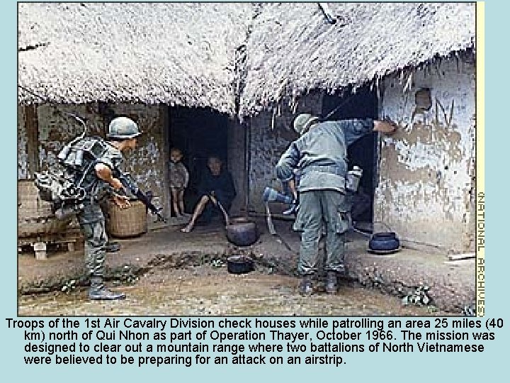 Troops of the 1 st Air Cavalry Division check houses while patrolling an area