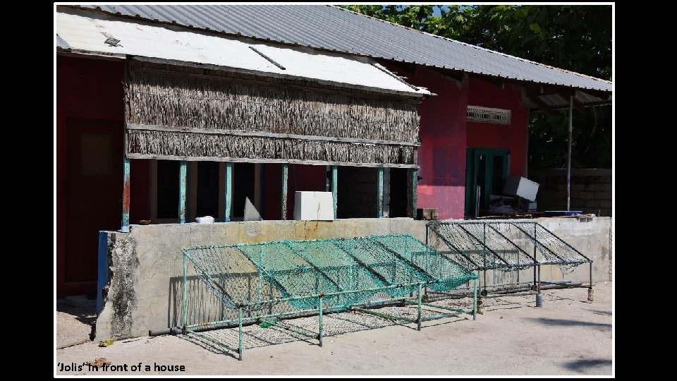 ‘Jolis’ in front of a house 