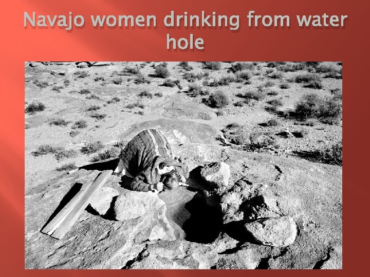 Navajo women drinking from water hole 