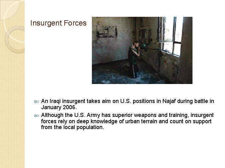 Insurgent Forces An Iraqi insurgent takes aim on U. S. positions in Najaf during
