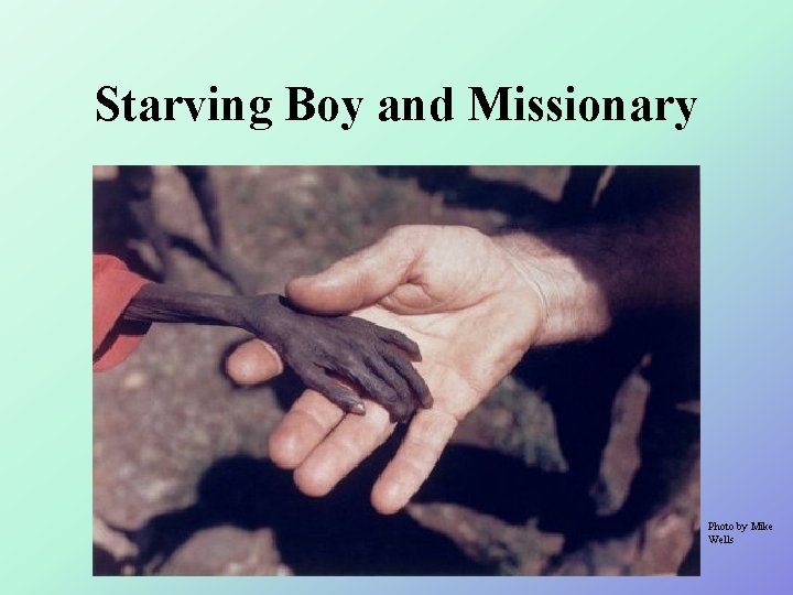 Starving Boy and Missionary Photo by Mike Wells 
