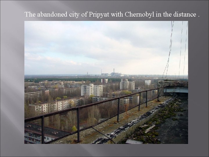 The abandoned city of Pripyat with Chernobyl in the distance. 