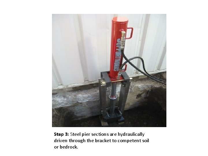 Step 3: Steel pier sections are hydraulically driven through the bracket to competent soil