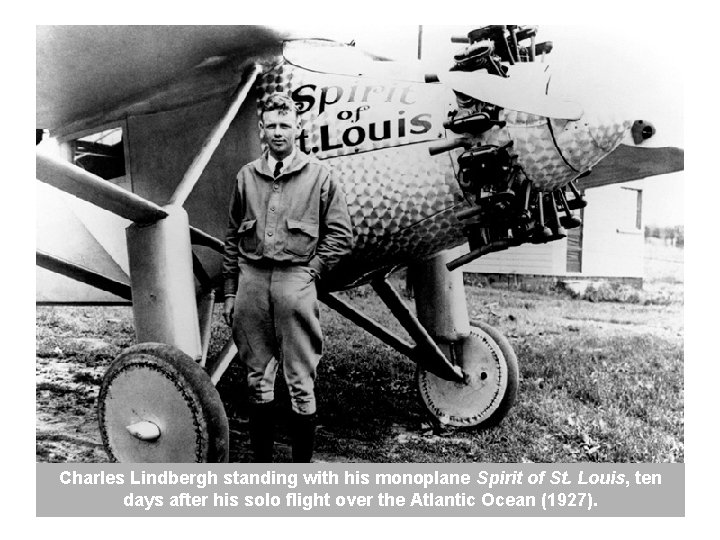 Charles Lindbergh standing with his monoplane Spirit of St. Louis, ten days after his