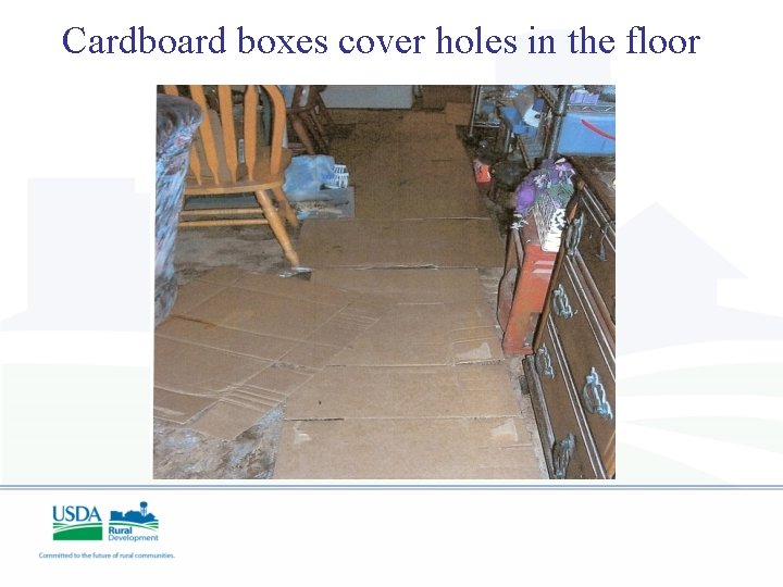 Cardboard boxes cover holes in the floor 