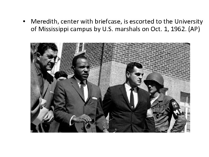  • Meredith, center with briefcase, is escorted to the University of Mississippi campus