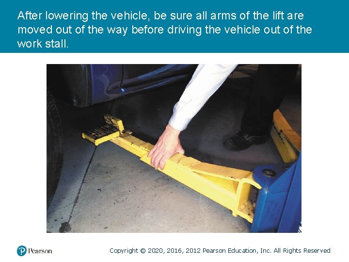 After lowering the vehicle, be sure all arms of the lift are moved out