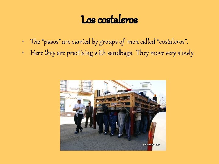 Los costaleros • The “pasos” are carried by groups of men called “costaleros”. •