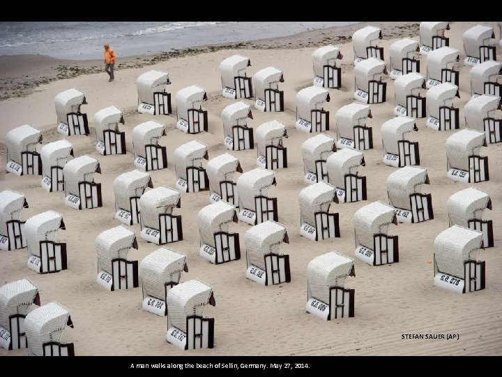 STEFAN SAUER (AP) A man walks along the beach of Sellin, Germany. May 27,