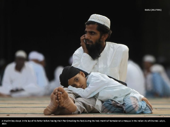 BABU (REUTERS) A Muslim boy sleeps in the lap of his father before having