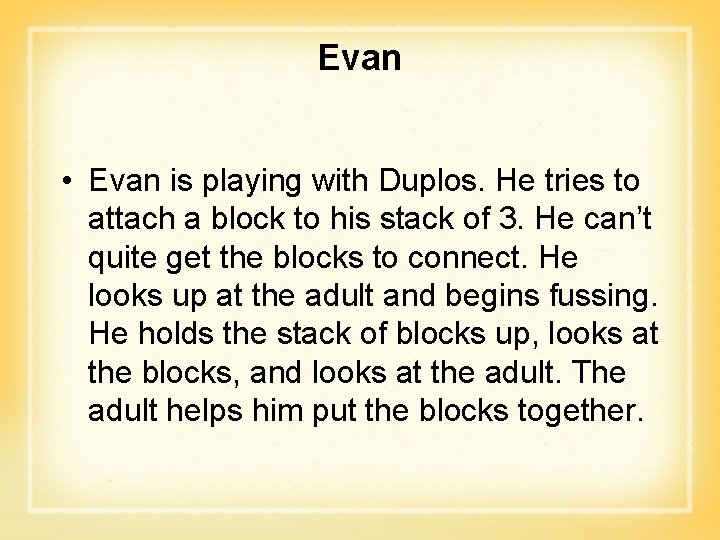 Evan • Evan is playing with Duplos. He tries to attach a block to