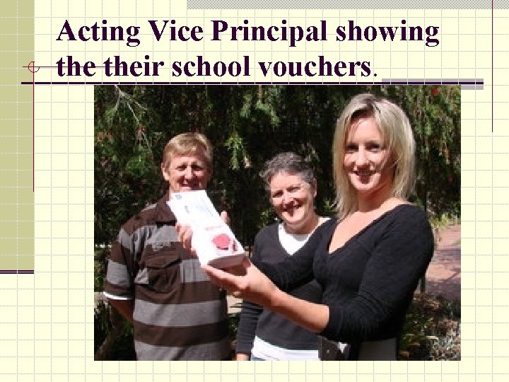 Acting Vice Principal showing their school vouchers. 