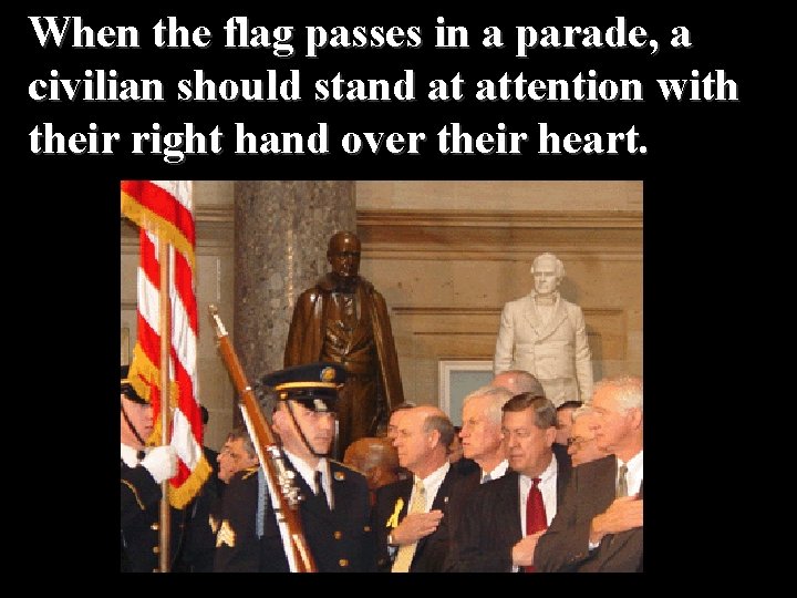 When the flag passes in a parade, a civilian should stand at attention with
