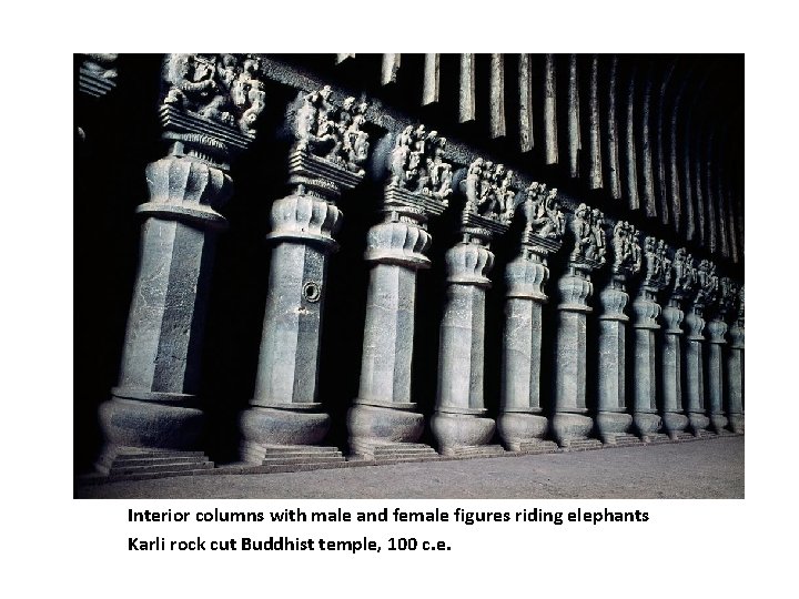 Interior columns with male and female figures riding elephants Karli rock cut Buddhist temple,