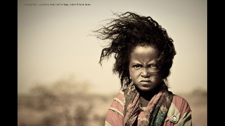 'Grumpy face' – a girl at a water well in Naga, Sudan © Rene