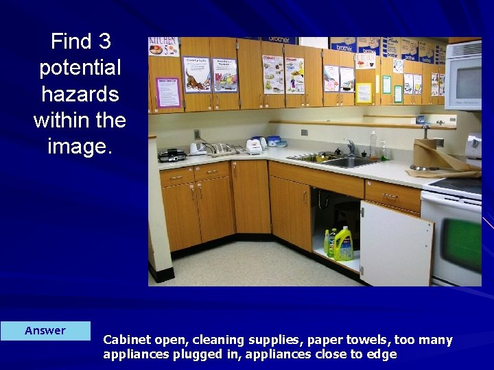 Find 3 potential hazards within the image. Answer Cabinet open, cleaning supplies, paper towels,