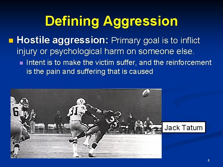 Defining Aggression n Hostile aggression: Primary goal is to inflict injury or psychological harm